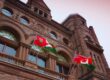 Ontario legislative building with Canadian and Ontario flags waiving out front